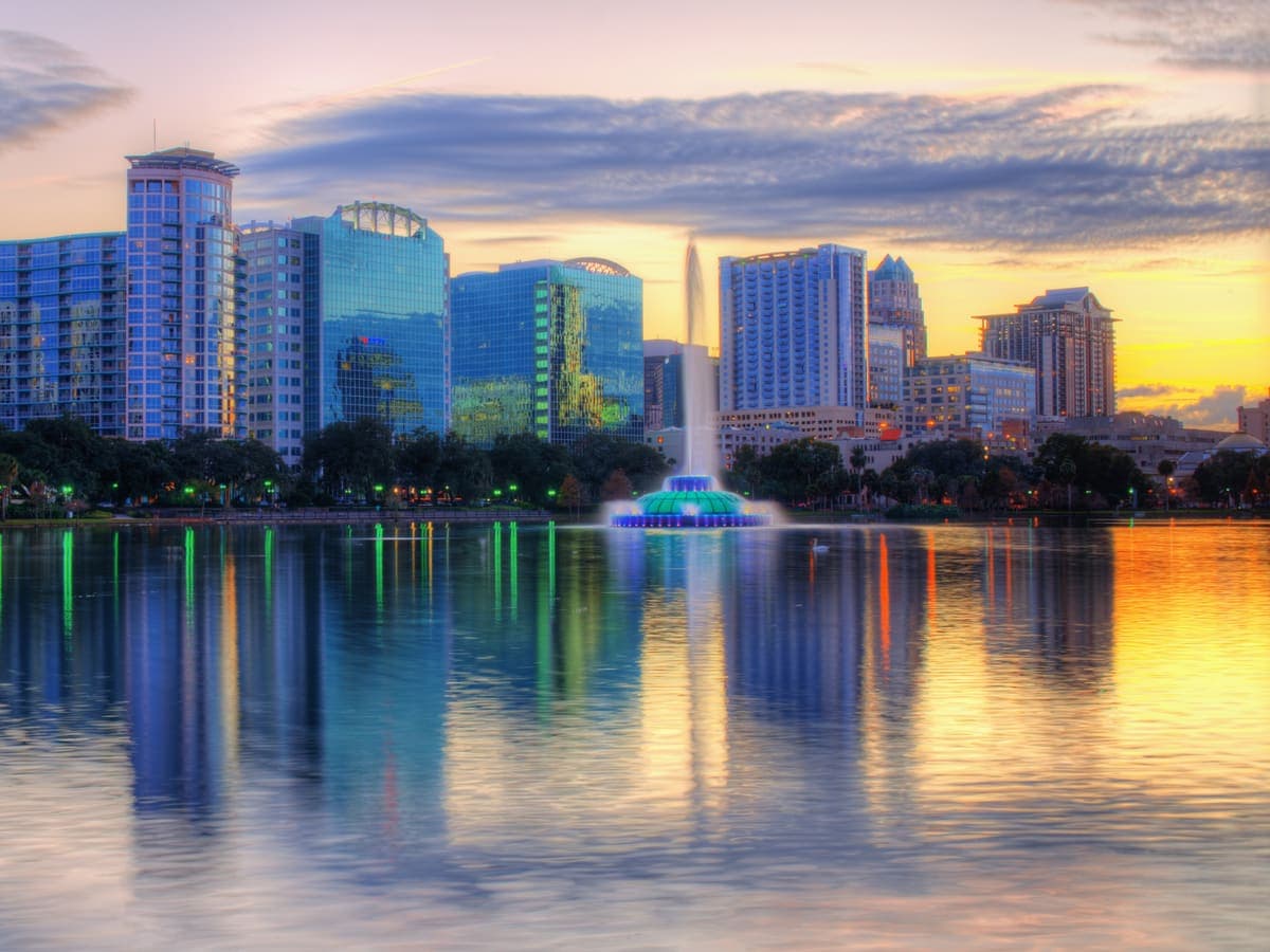 The Orlando skyline reflected in Lake Eola at golden hour